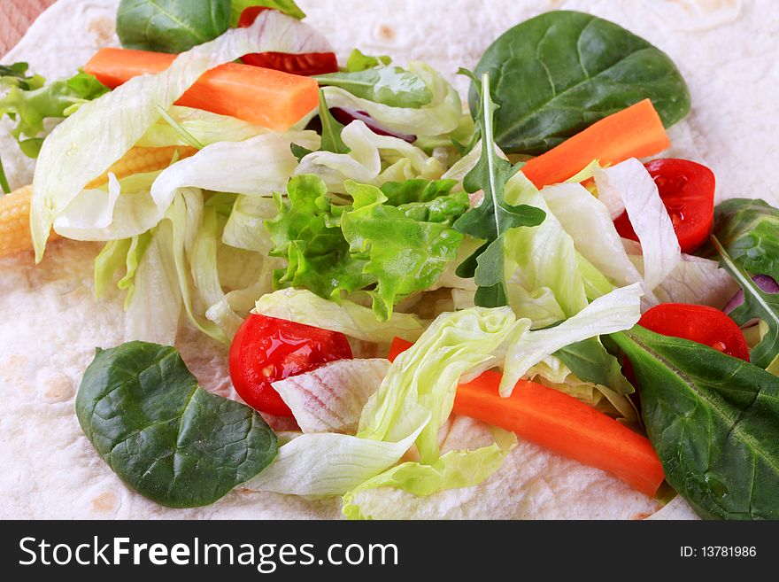 Fresh vegetable salad on tortilla - detail