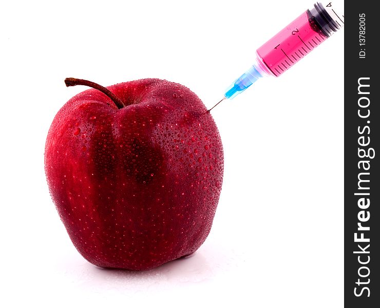 Red Apple With Syringe Injecting Color on Isolted White Background