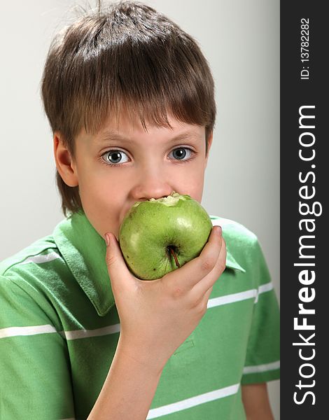 Boy with apple in hands