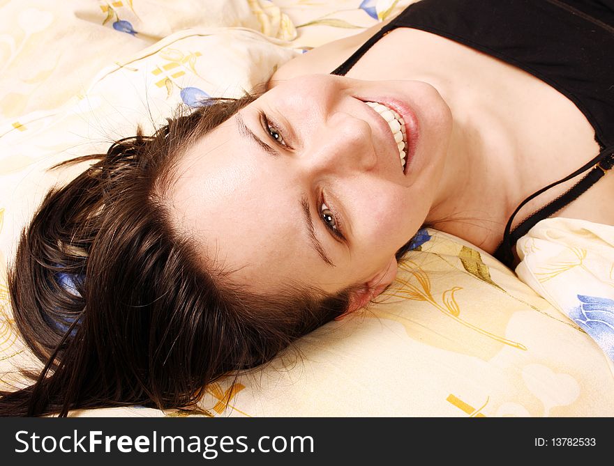 Happy woman in bed in the morning