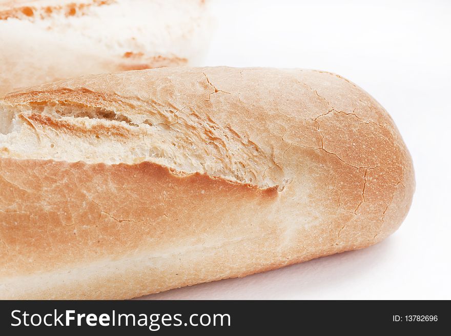 Traditional french bread on white (baguette)