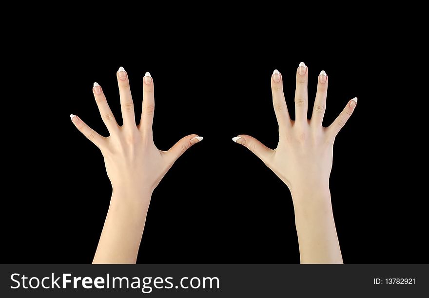 Two woman's hands in darkness