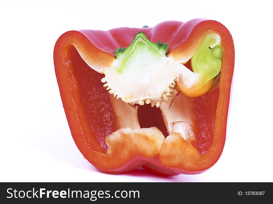 A half red bell pepper on white background