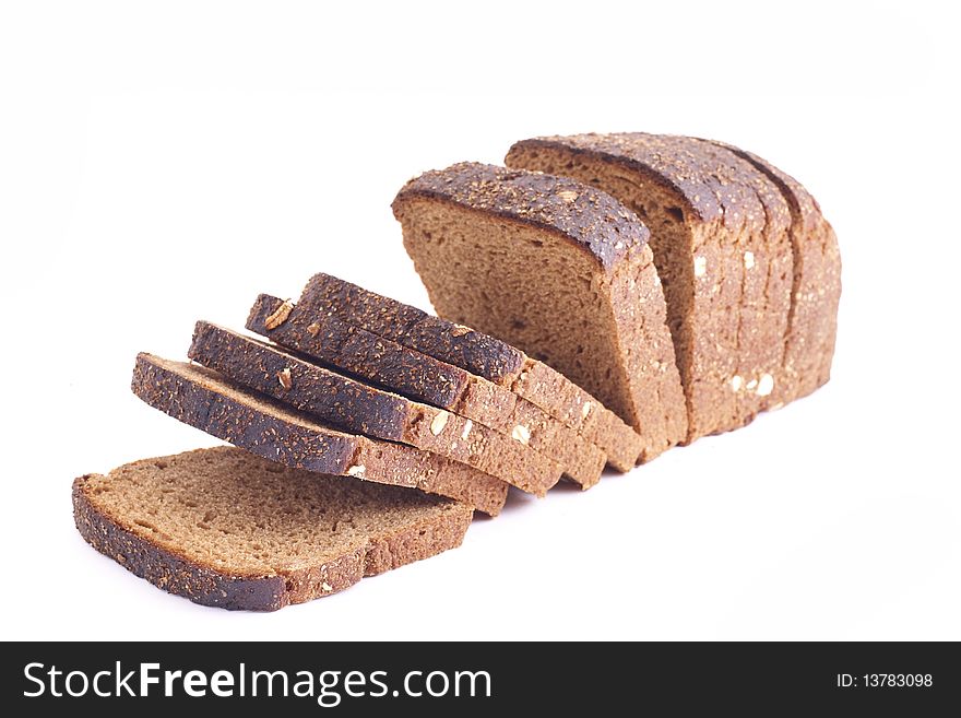 Several slices of whole grain bread over a white background