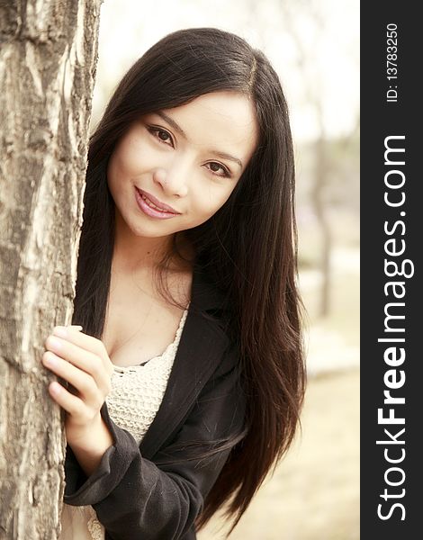 Portrait of a modern asian girl outdoors in spring.