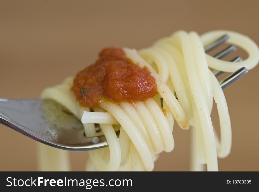 Freshly made spaghetti rolled on fork. Freshly made spaghetti rolled on fork