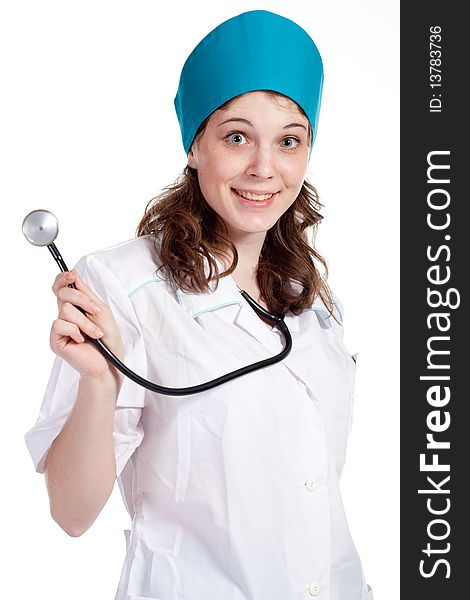 Attractive young female doctor holds a stethoscope, isolated on white background