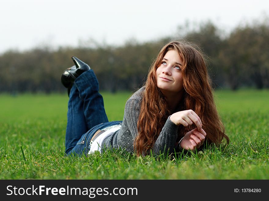 Relaxign Girl On Green Grass