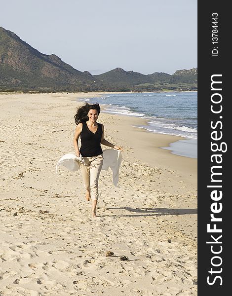 Young woman running on the beach