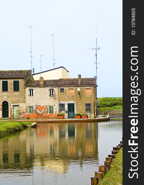 Houses on the river on a rainy day