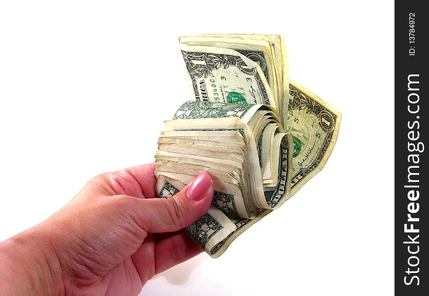 A woman's hand grasping a roll of money. A woman's hand grasping a roll of money