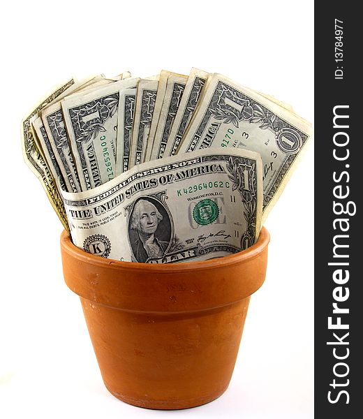 Dollar bills growing from a flower pot. Dollar bills growing from a flower pot