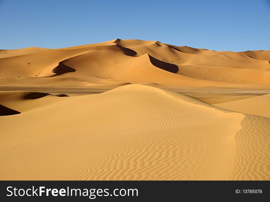 Sand dunes in the desert of Libya, in Africa. Sand dunes in the desert of Libya, in Africa