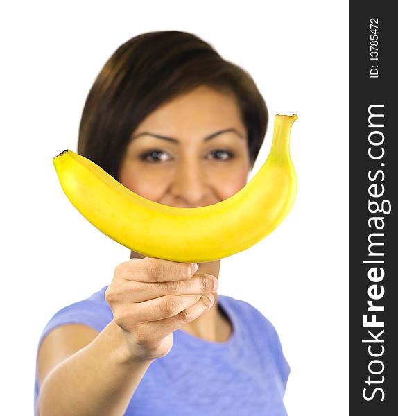 Young woman holds a banana