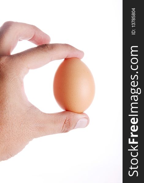Egg in hand over white background. Food image