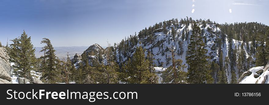 Panoramic view from above palm springs aerial tram of a snow capped mountain. Panoramic view from above palm springs aerial tram of a snow capped mountain