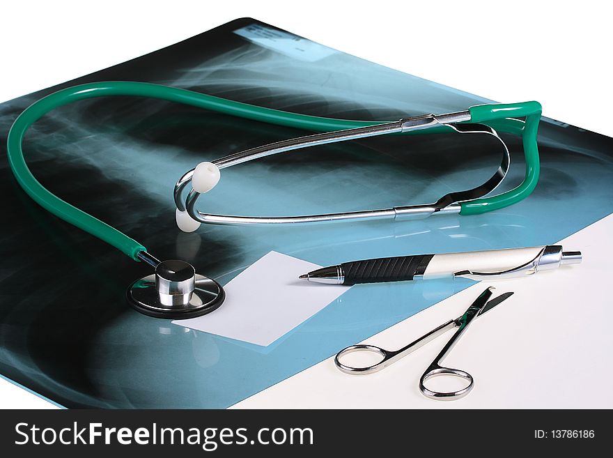 X-ray with a stethoscope, scissors and business card with pen.