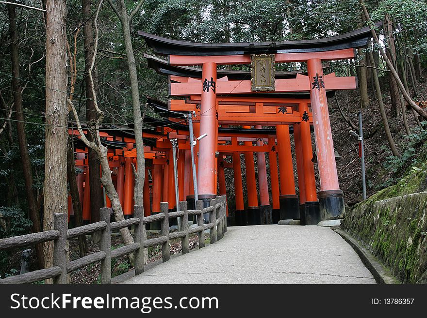 These are Torii gates at Fushimi-inari Shrine, Kyoto, Japan. These gates are found throughout the forest and lead up to the main shrine on the hill top. These are Torii gates at Fushimi-inari Shrine, Kyoto, Japan. These gates are found throughout the forest and lead up to the main shrine on the hill top.