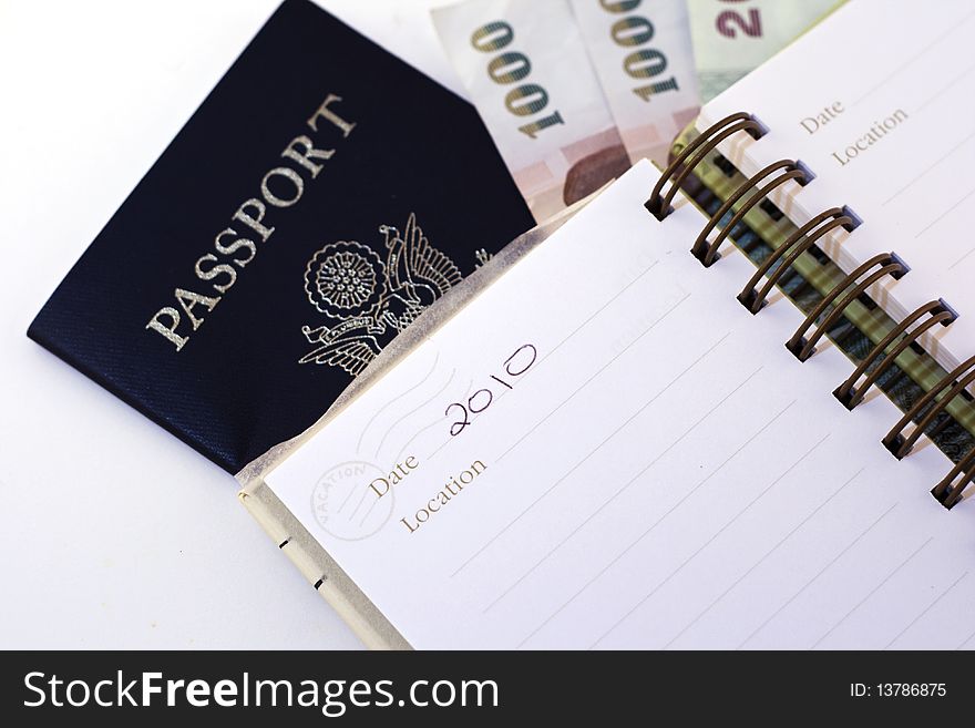 Passport and notepad with world currency. Passport and notepad with world currency