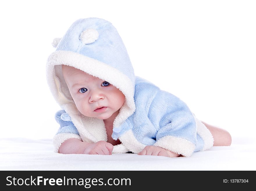 Cute little boy with a warm coat on white background