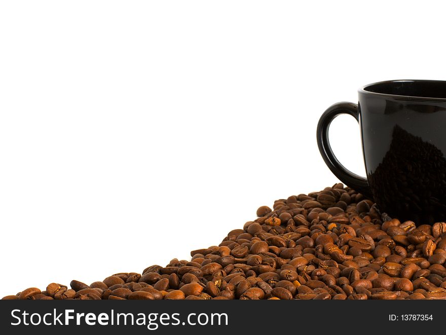 Black cup and coffee beans isolated on white background