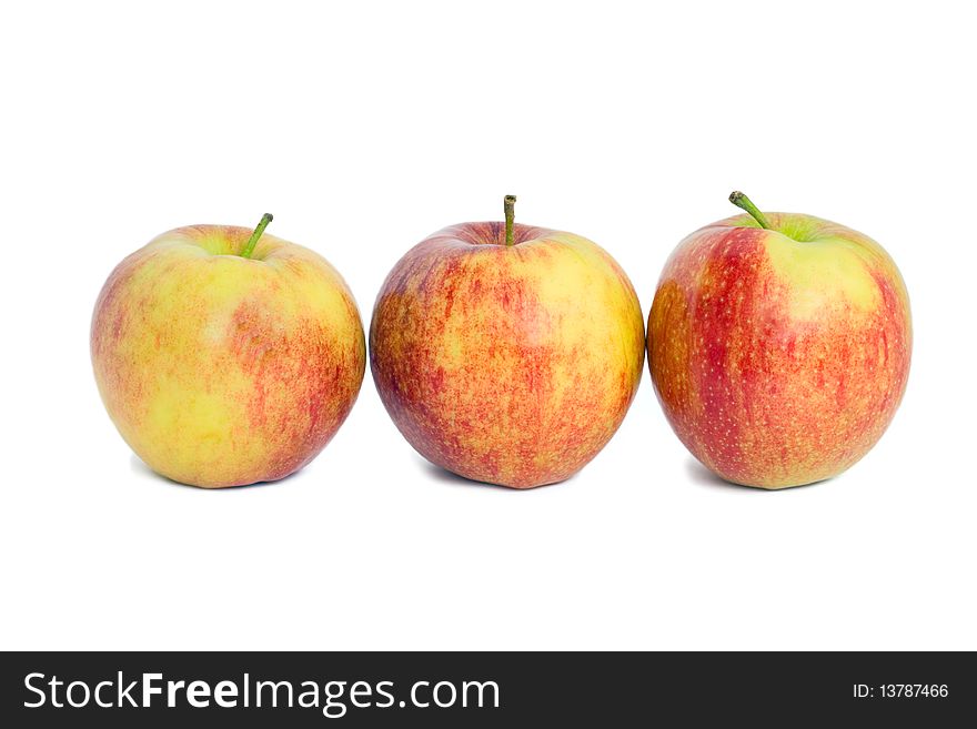 Three red apples on a white background.