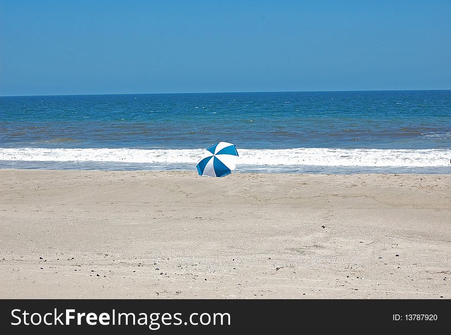 Lonely umbrella on the beach