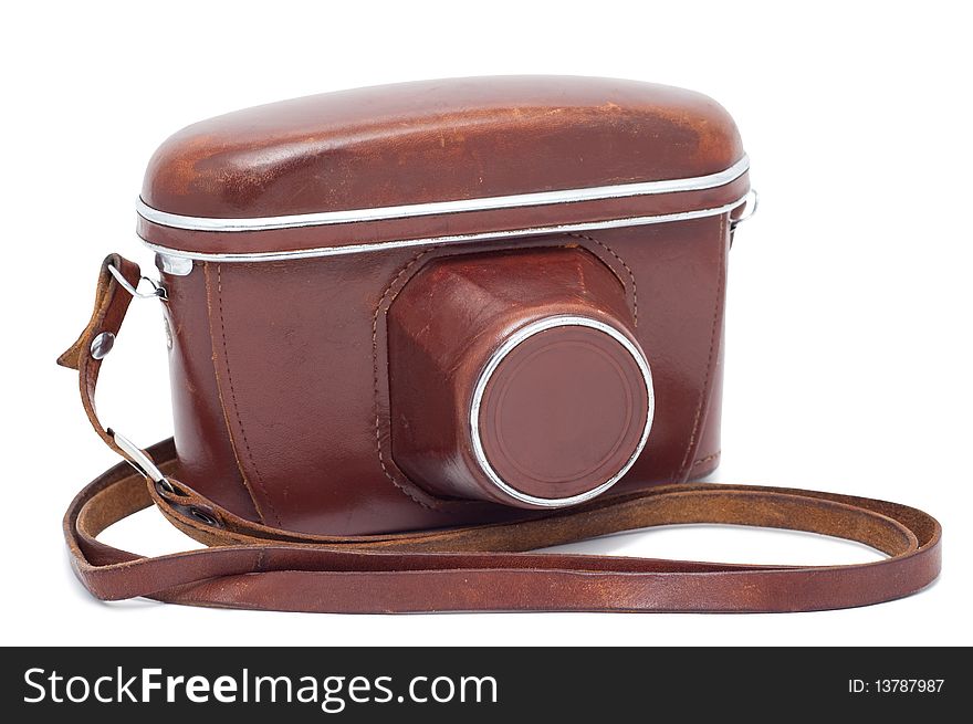 Old camera in a cover isolated on a white background shadow below. Old camera in a cover isolated on a white background shadow below.