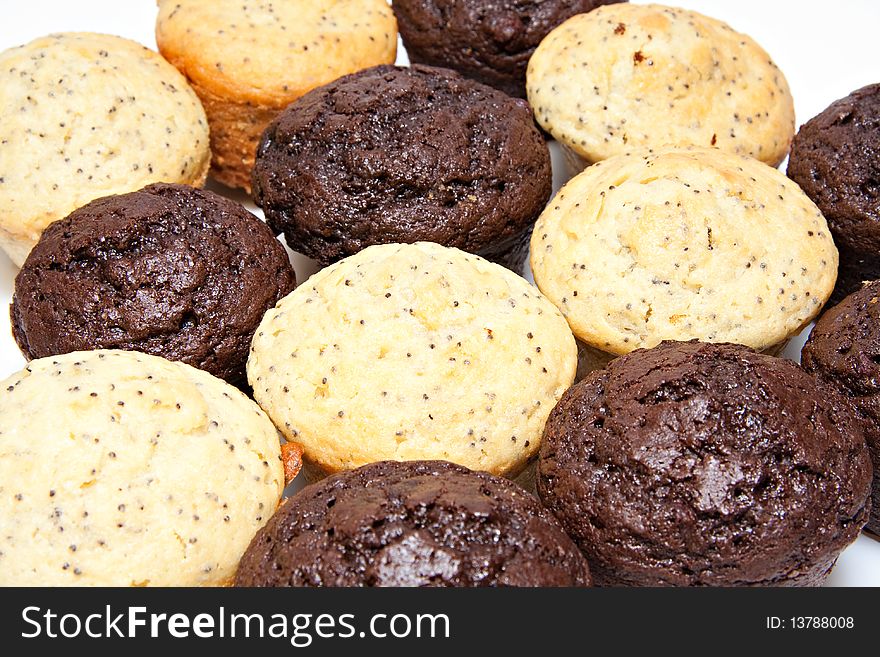 Lemon poppy seed and chocolate muffins closeup. Lemon poppy seed and chocolate muffins closeup