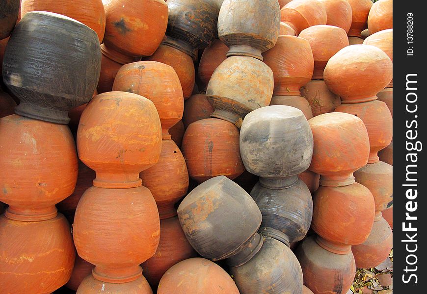 Many clay pots at a potters shop used for storing water in summer in india. Many clay pots at a potters shop used for storing water in summer in india