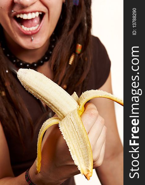 Girl with dreadlocks carring fresh banana isolated. Girl with dreadlocks carring fresh banana isolated