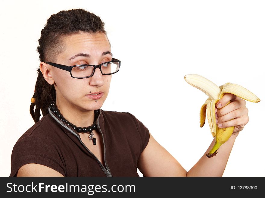 Girl with dreadlocks carring fresh banana. Girl with dreadlocks carring fresh banana