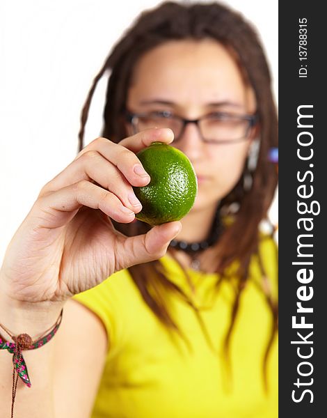 Girl with dreadlocks carring fresh little lime. Girl with dreadlocks carring fresh little lime