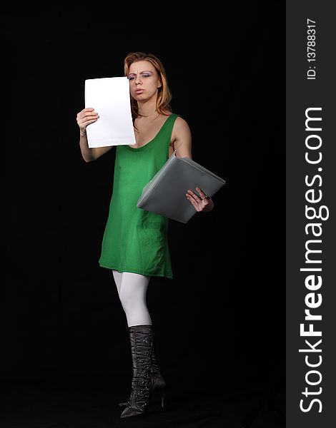 The girl with a folder on a black background