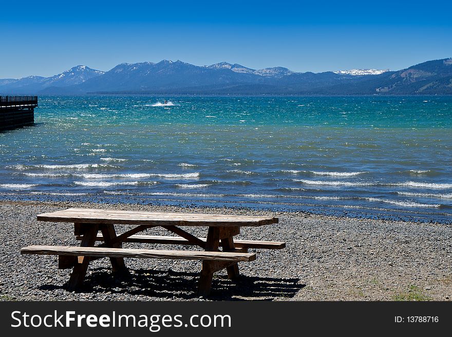 Picnic bench at the shoreline of Lake Tahoe California. Picnic bench at the shoreline of Lake Tahoe California.