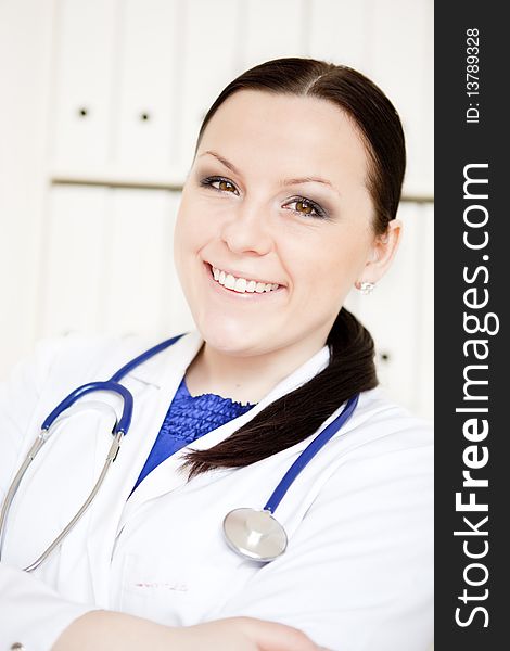 Doctor woman with stethoscope in office