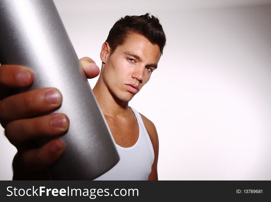 Young man with silver bottle. Young man with silver bottle
