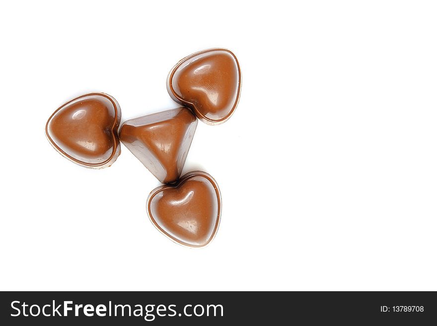 Delicious background of swiss dark chocolates, milk chocolates, pralines and truffles. white background