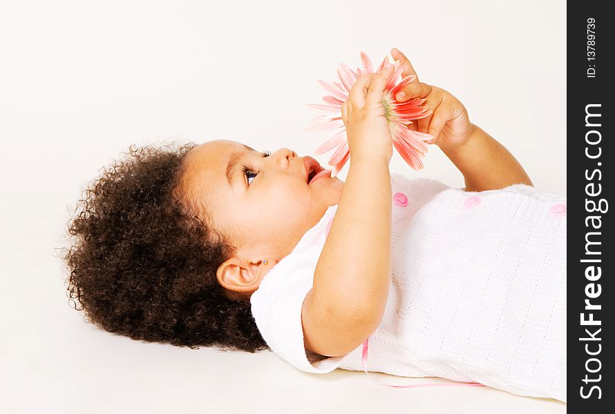 Tender little girl with a flower