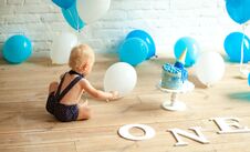 One Year Old Boy Is Celebrating His First Birthday Among A Balloons And Festive Cake Stock Photos One Year Old Boy Is Celebrating His First Birthday Among A Balloons And Festive Cake Stock Photos