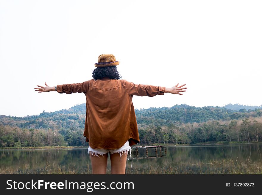Beauty asian woman traveler stand and open arms at beautiful place. Beauty asian woman traveler stand and open arms at beautiful place