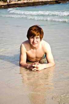 Happy Boy In Foam Of Beach Stock Images