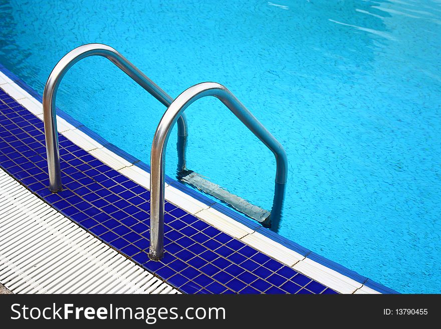 Luxury hotel poolside and ladder