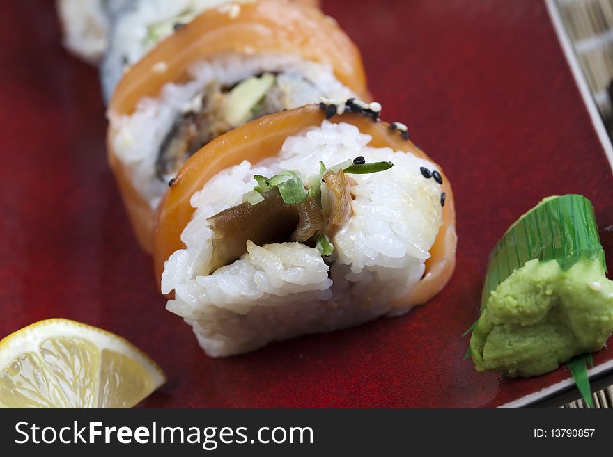 A complete sushi meal with chopsticks on tatami mat