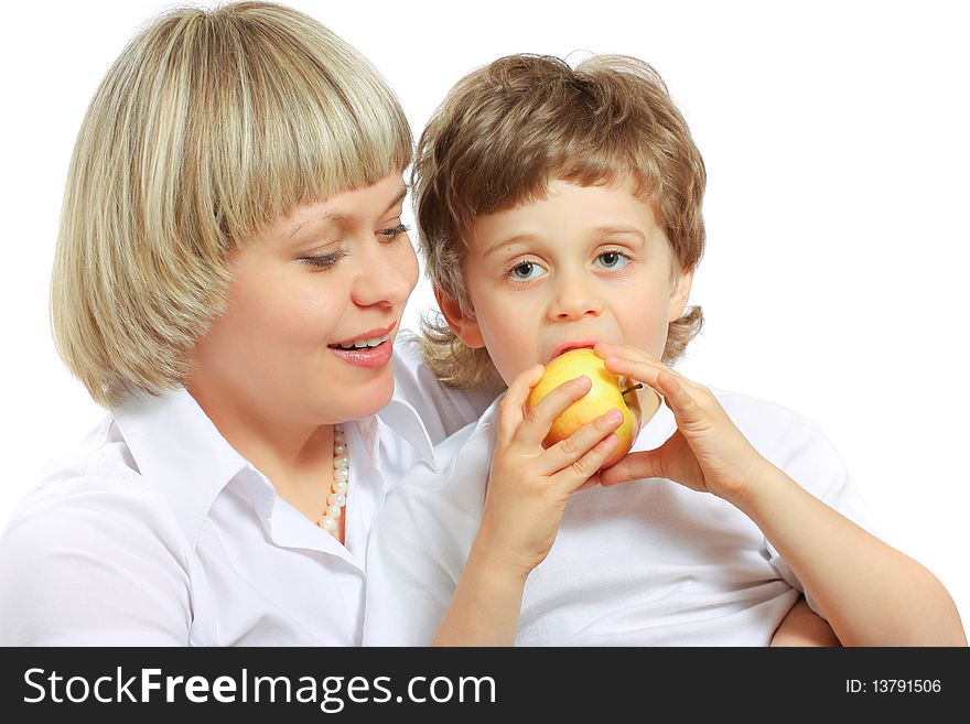 Woman And Boy Eating Apple