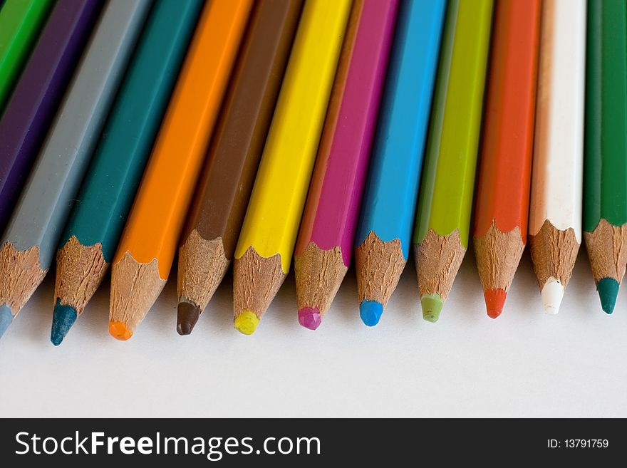 Assortment of coloured pencils isolated on white background