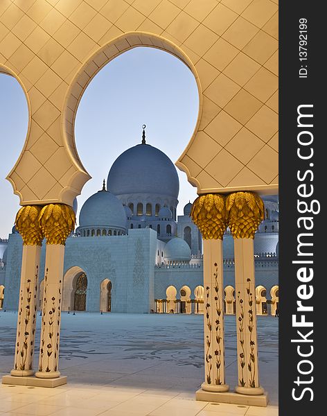 A mosque dome framed by arches