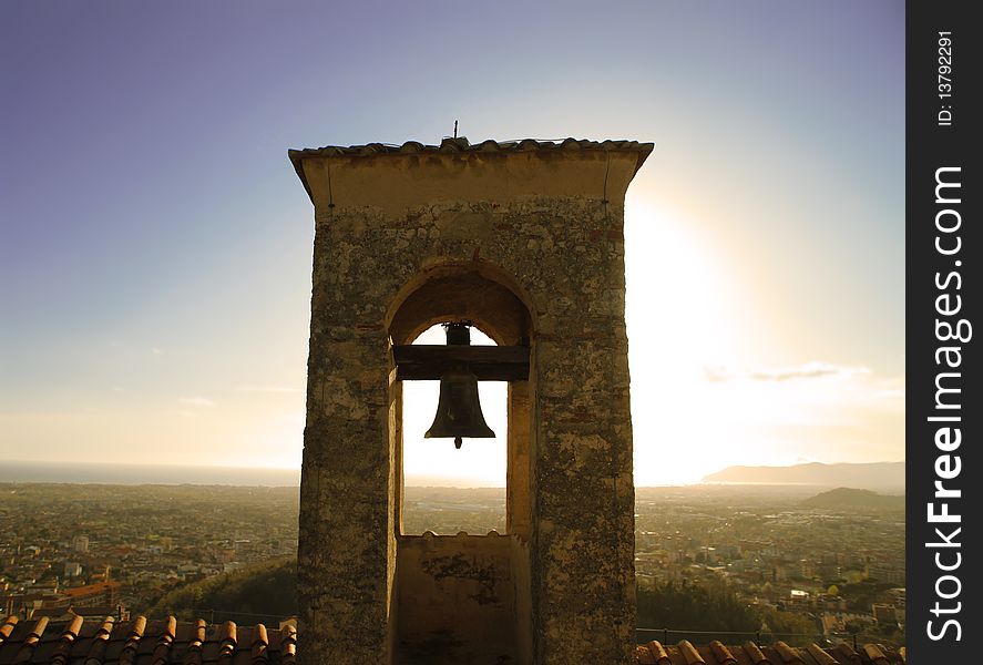 View of an ancient bell tower with view on hills