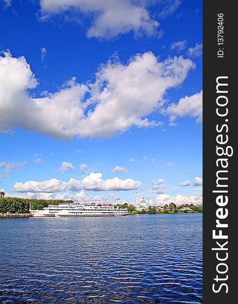 Motor ship on pier on river