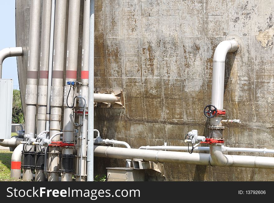 Many plastic pipes set against the tower